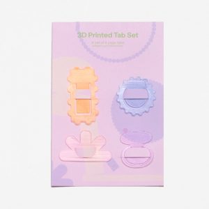 A set of four page markers in different shapes and translucent colours.