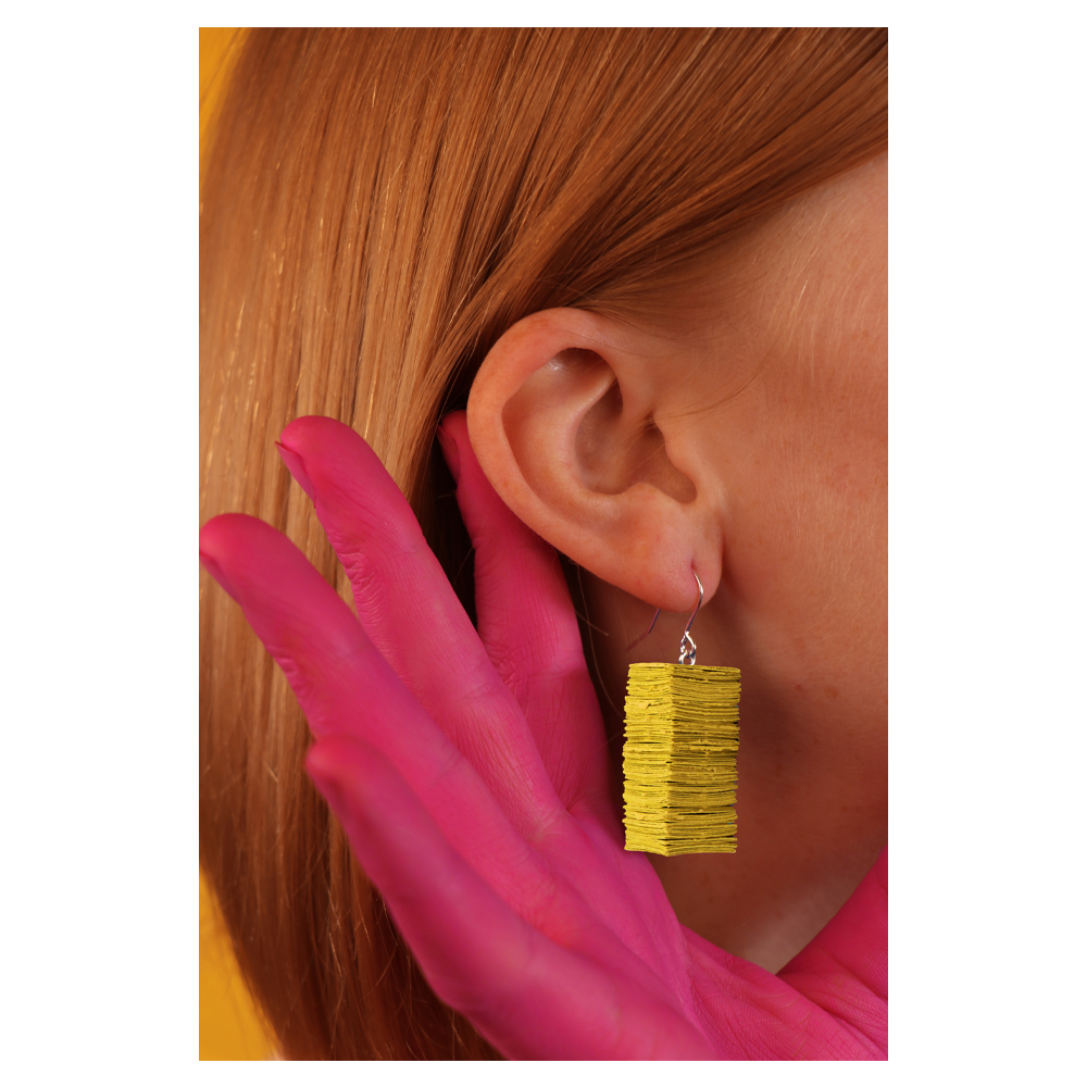 Yellow 'Audrey' earrings on a model