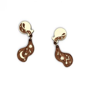 Pair of laser-cut wood earrings in the shape of spilled potions with stars.