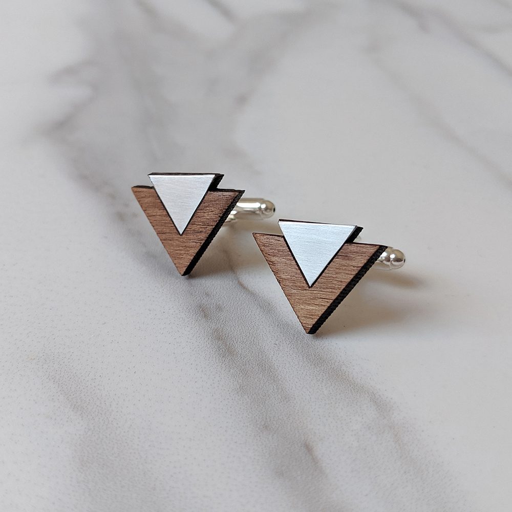 white and brown cufflinks