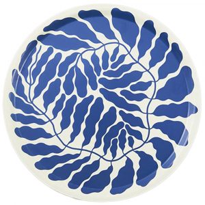 A circular serving tray with a spiraling blue leaf motif.