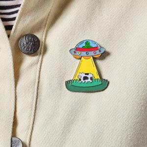 Alien Enamel Pin on cream jacket