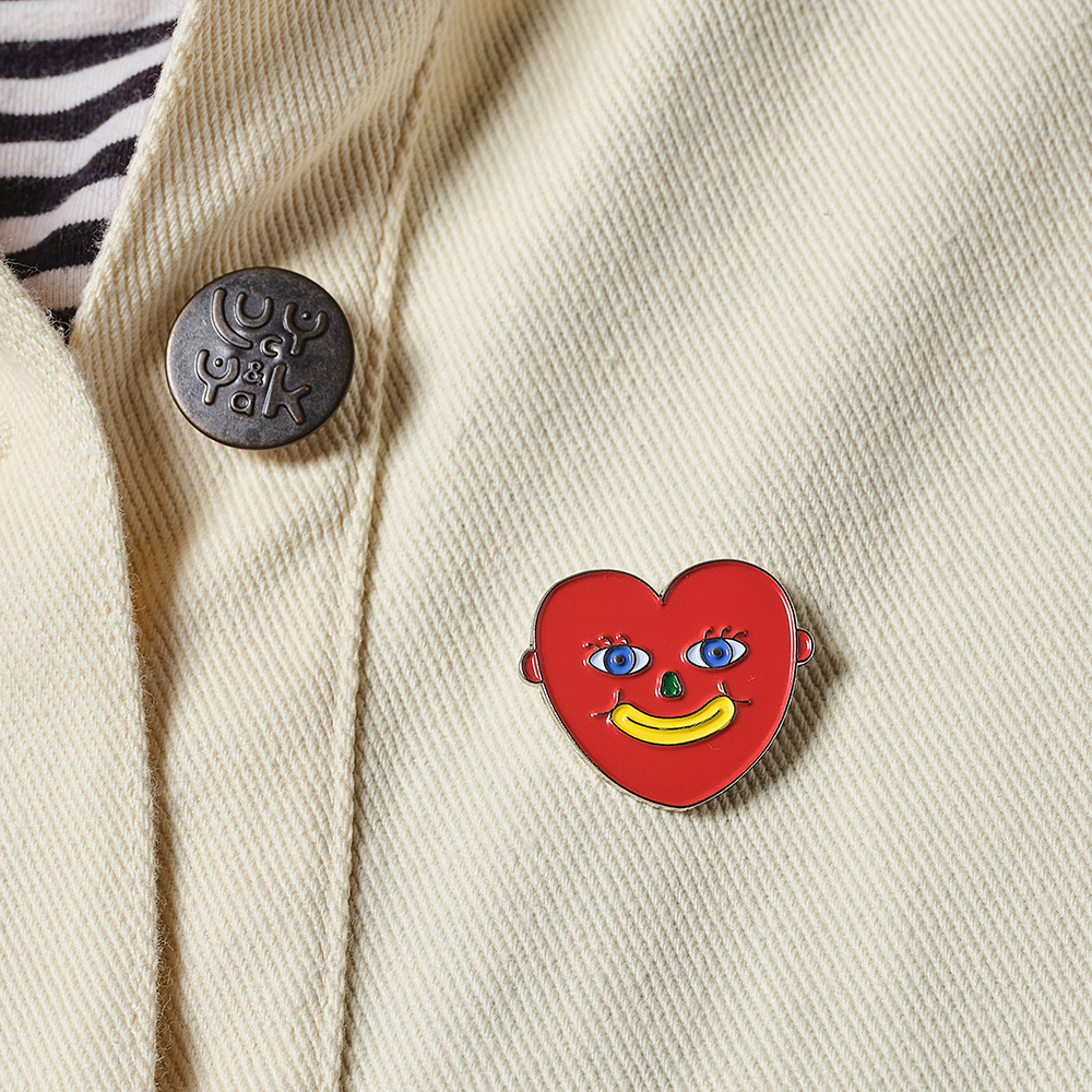Red Heart Enamel Pin on cream jacket
