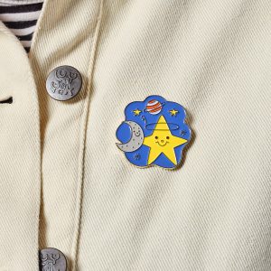 Starry night enamel pin on cream jacket