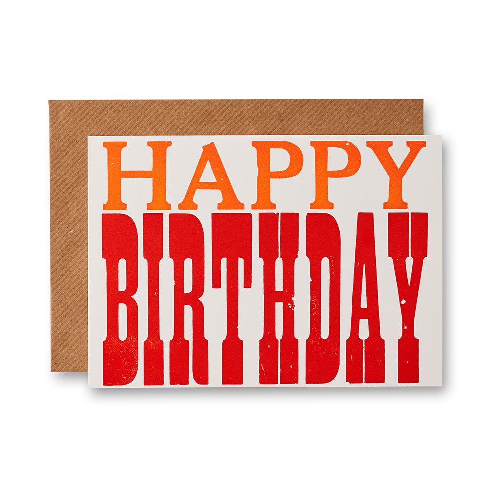 A card with the words 'Happy Birthday' in orange and red type.