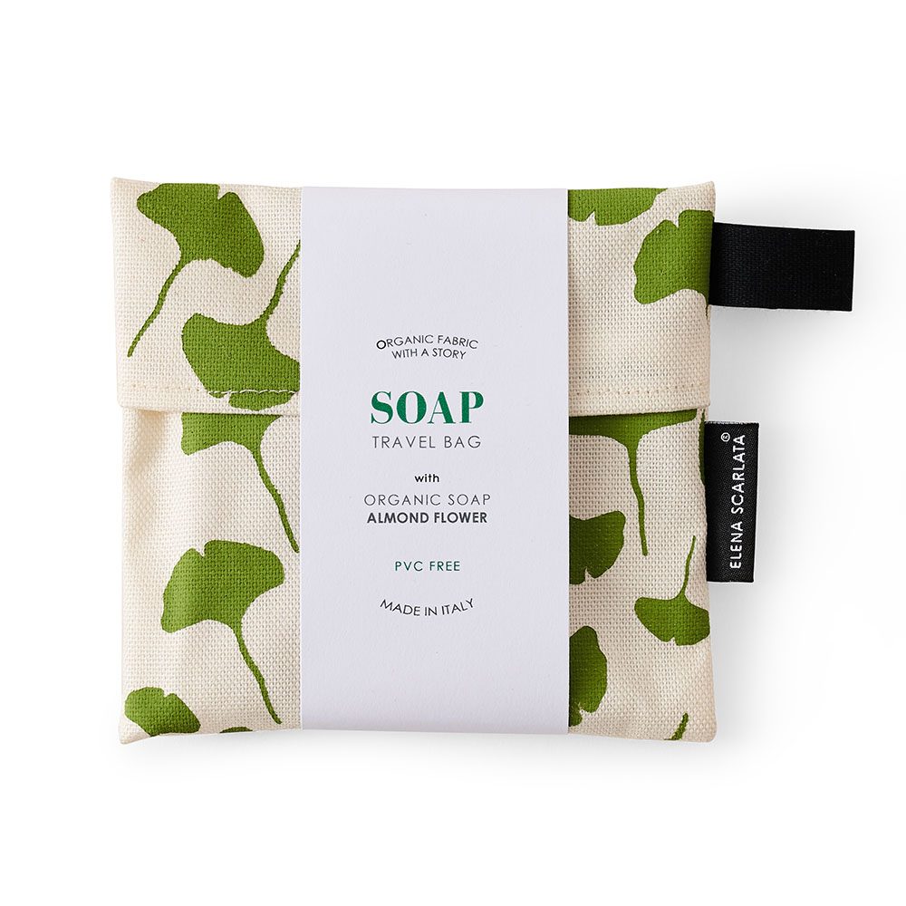 A travel bag with organic soap inside featuring a leaf print.
