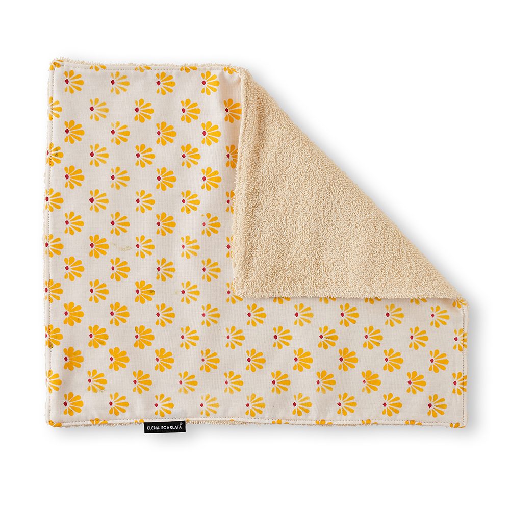 Face towel with yellow print.