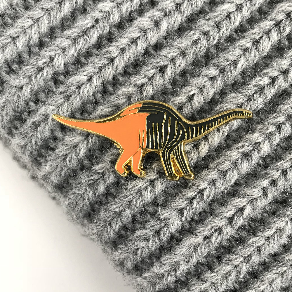 Rebbachisaurus enamel pin by James Barker