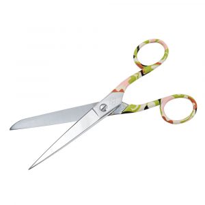 A pair of embroidery scissors with the handles in a khaki coloured print.