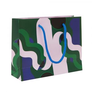 Gift bag featuring a graphic print in lilac, blue and green.