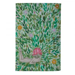 A rectangular tea towel, featuring an artwork of a blue leafed field. In the middle, is the form of a woman with a mushroom for a head. A very whimsicle style.