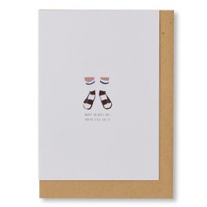 White card with small illustration of two legs wearing socks and sandals