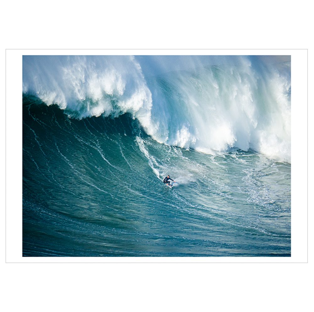 The landscape photograph shows a surfer competing at a competition in Nazaré, where some of the world's biggest waves can be found.