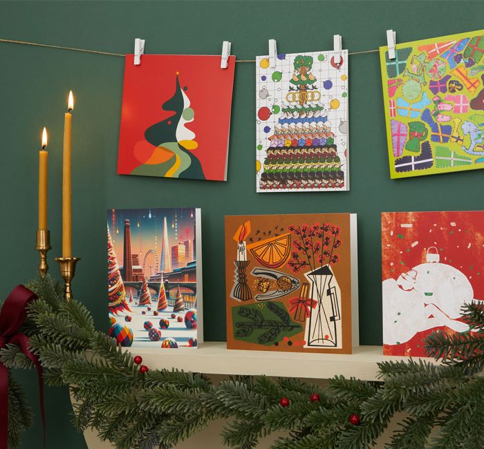 6 UAL x Tate Christmas Cards displayed on a fireplace mantle